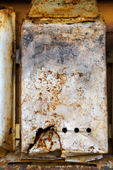 old post box on the wall of a building, old weathered paint