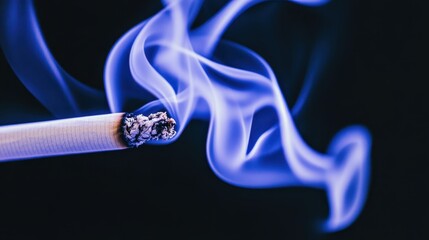 Cigarette burning with blue smoke rising against dark background