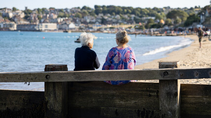 Two Old Wimen on a Beach Bench