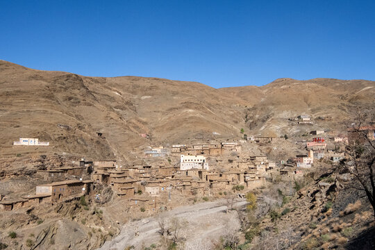 Morocco - Ancient poor village, clay architecture. Small valley on the road from Marrakech and Sahara,  North Africa
