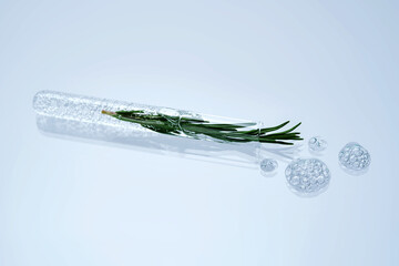A test tube with rosemary inside and a cosmetic texture.