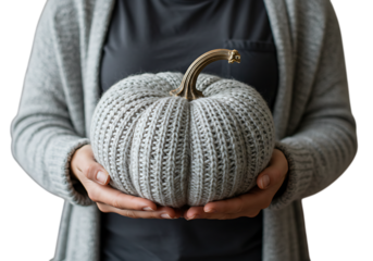 Woman holding a knitted pumpkin isolated on transparent background