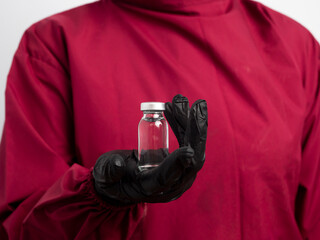 Close-up of a doctor, nurse, and female scientist holding a blank vial on an isolated background....