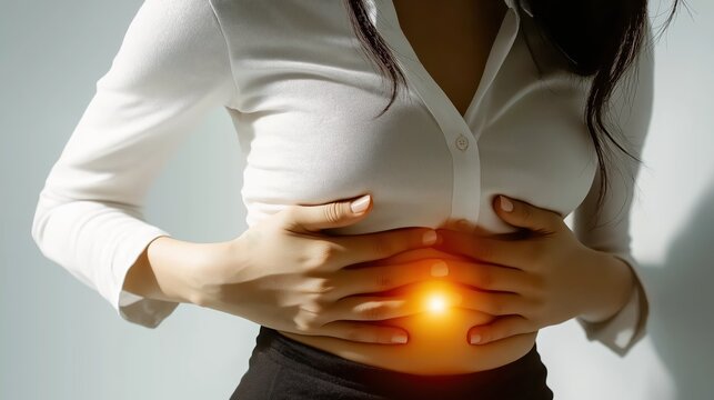 Woman suffering from piriformis muscle pain, holding her lower abdomen with both hands, isolated on white background with soft natural light in a realistic medical photo.