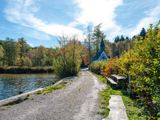 CLandscape of chapel benches and forest at the lake shore