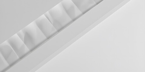  flat lay of monochrome paper layers forming soft diagonal ridges in white and pale gray tones