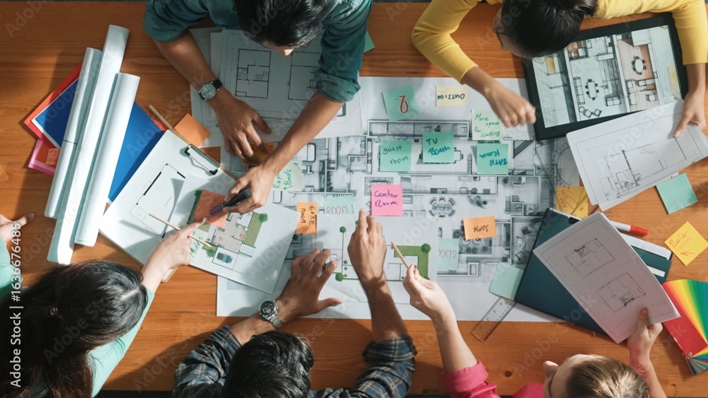 Poster top down aerial view of civil engineer team holding blueprint at meeting room. aerial view of group 