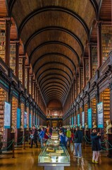 Fototapeta premium Visitors Explore the Iconic Trinity College Library in Dublin