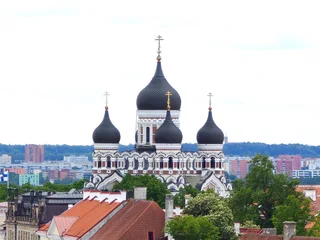 Fotobehang Smalle Straten Aerial view of Tallinn Old Town, Estonia, showcasing historic medieval architecture, red rooftops, narrow cobblestone streets, and city walls. The image captures the charming and well-preserved herita  © Fotoleaf