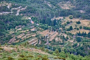 Wide panoramic view of valley and countryside from mountains