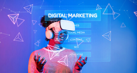 A young woman joyfully embraces virtual reality technology for developing digital marketing...