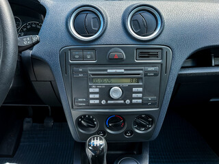 The modern car dashboard is equipped with an advanced audio system alongside intuitive climate...