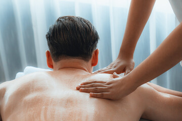 Caucasian man customer enjoying relaxing anti-stress spa massage and pampering with beauty skin...