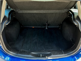 Discover the spacious hatchback trunk with a sleek dark fabric finish and functional storage...