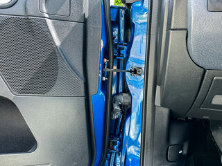 A closeup of the intricate car door mechanism and interior detailing showcases the slim design and...