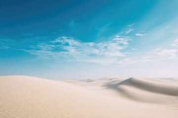 Endless dunes stretch under bright blue sky, creating serene des
