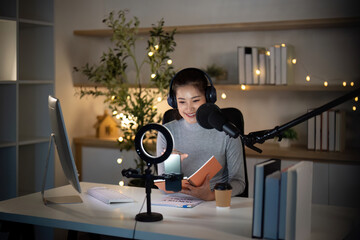 Podcast recording session with young woman in cozy studio