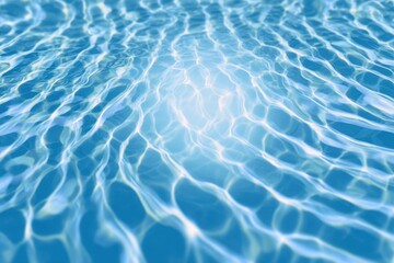 Abstract blue transparent water surface texture natural ripple background. clear water wave texture on blue background. Sunlight effect on surface of defocus blurred water. summer or spa concept