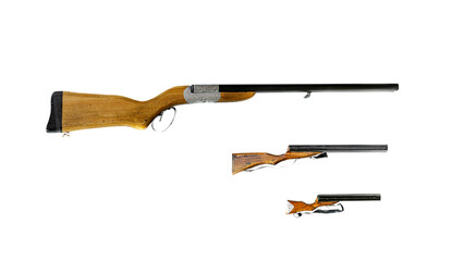 Old traditional black powder rifle Three decorative shotguns with black metal barrels, wooden combs and grips decorated with engravures on a silver colored metallic band. Isolated in white background.