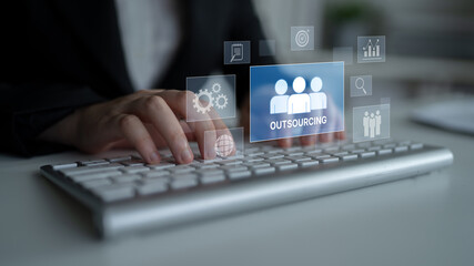 Outsourcing concept showing collaboration, delegation, global workforce, productivity, and task management through remote teams and external service providers Latch