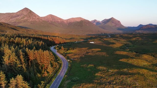 Stunning aerial views of Skye Island in Scotland showcasing breathtaking landscapes and winding roads at sunset
