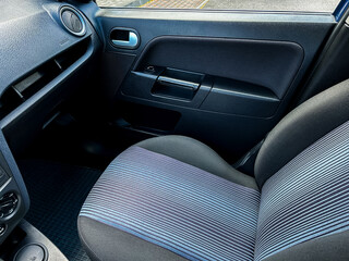 Modern car interiors provide not only stylish designs but also feature highquality fabric seats, which greatly enhance both aesthetics and comfort, ensuring an enjoyable journey for all passengers