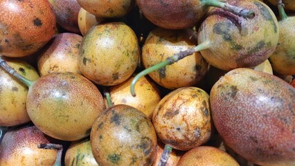 Fresh of Markisa konyal or passion fruits for sale at supermarket in Indonesia