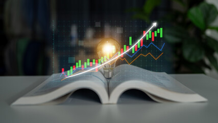 A creative composition featuring an open book, a glowing light bulb, and a dynamic financial chart,...