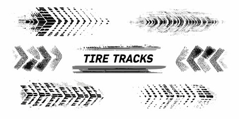 Collection of grungy black tire tracks and markings