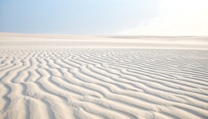 Naklejka premium Sand Dune Landscape with Ripples Under a Bright Sky
