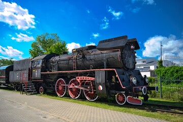 An old locomotive standing on the platform.