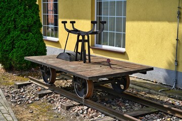 A handcar standing on the tracks.