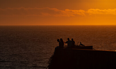 Sunset Silhouettes by the Sea © David
