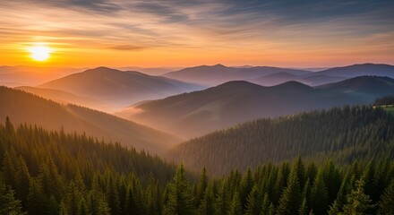 Majestic mountain landscape at sunrise with misty valleys and green forests
