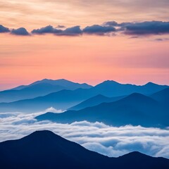 Fototapeta premium Majestic mountain peaks bathed in soft sunrise hues
