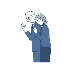 合掌している喪服姿の男女