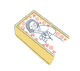 棺桶の中の花に囲まれたご遺体
