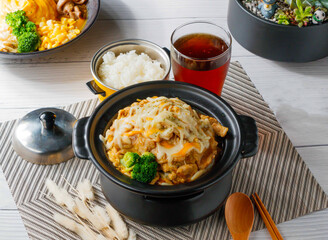 Sizzling Chicken Pot with Melted Cheese, Served with Steamed Rice and Iced Tea side view of taiwan food