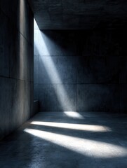 Obraz premium sunlight streaming into dark concrete room with dramatic shadows