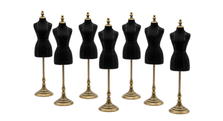 Seven elegant dress forms stand in a row against a black backdrop, minimalist style.