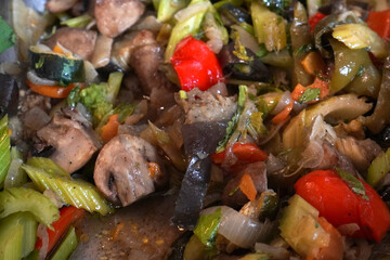 Fried vegetables and meat on a plate