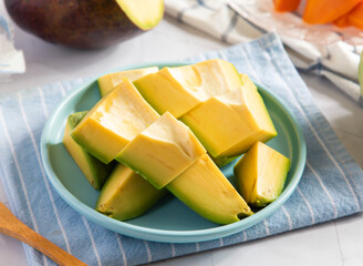 Ripe Avocado Chunks on a Plate side view of Healthy fruit snack
