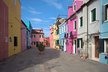 Colorful residential street with facades in Burano Italy