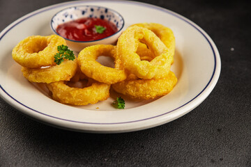 Colmar rings fried food fries fast food crispy appetizer fresh delicious gourmet food background on the table rustic food top view copy space