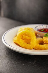 Colmar rings fried food fries fast food crispy appetizer fresh delicious gourmet food background on the table rustic food top view copy space