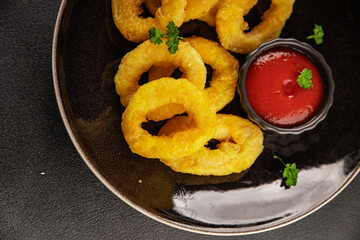 Colmar rings fried food fries fast food crispy appetizer fresh delicious gourmet food background on...