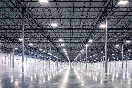 large empty warehouse with steel beams and metal ceiling