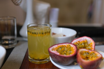 passion fruit juice sliced exotic organic fresh passion fruit with flowing dripping fresh water drops isolated on warm colorful background. High quality 4k footage