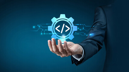 Professional hand holding a glowing coding gear icon, symbolizing software development, innovation, and digital transformation