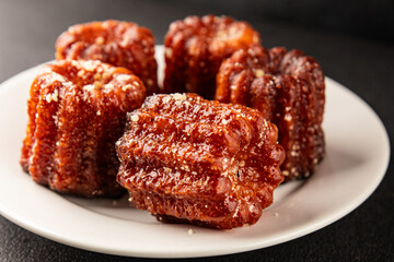 Canneles sweet dessert french cuisine sweets fresh delicious gourmet food background on the table...